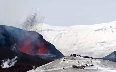 Tourists&nbsp;gather&nbsp;to&nbsp;watch&nbsp;lava&nbsp;spurt&nbsp;out&nbsp;of&nbsp;the&nbsp;site&nbsp;of&nbsp;a&nbsp;volcanic&nbsp;eruption&nbsp;at&nbsp;the&nbsp;Fimmvorduhals&nbsp;volcano&nbsp;near&nbsp;the&nbsp;Eyjafjallajokull&nbsp;glacier,&nbsp;some&nbsp;125&nbsp;kms&nbsp;east&nbsp;of&nbsp;Reykjakic&nbsp;on&nbsp;March&nbsp;27.&nbsp;(Xinhua/AFP,&nbsp;File&nbsp;Photo)