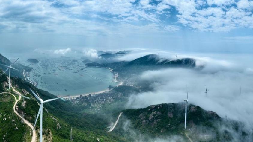 Aerial view of wind farm shrouded in fog in Lianjiang, China's Fujian
