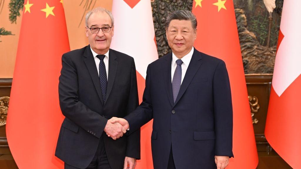 Xi meets president of Swiss Confederation, calling for more certainty for China-Europe economic, trade cooperation